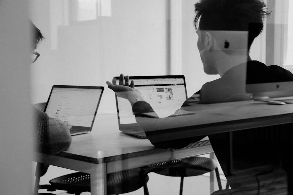 Swan Technologies delivery team reviewing a program plan with a client